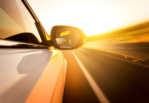 Driving along a highway at sunset